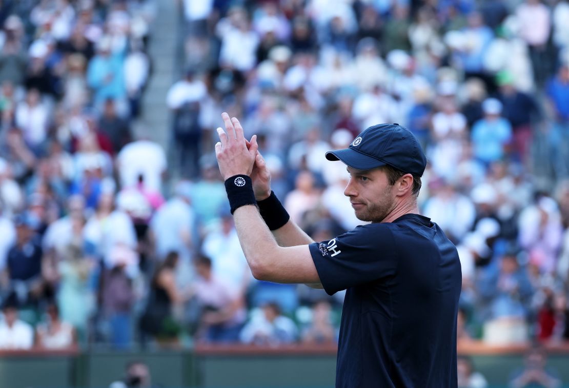 Botic van de Zandschulp applauds the crowd after his victory.