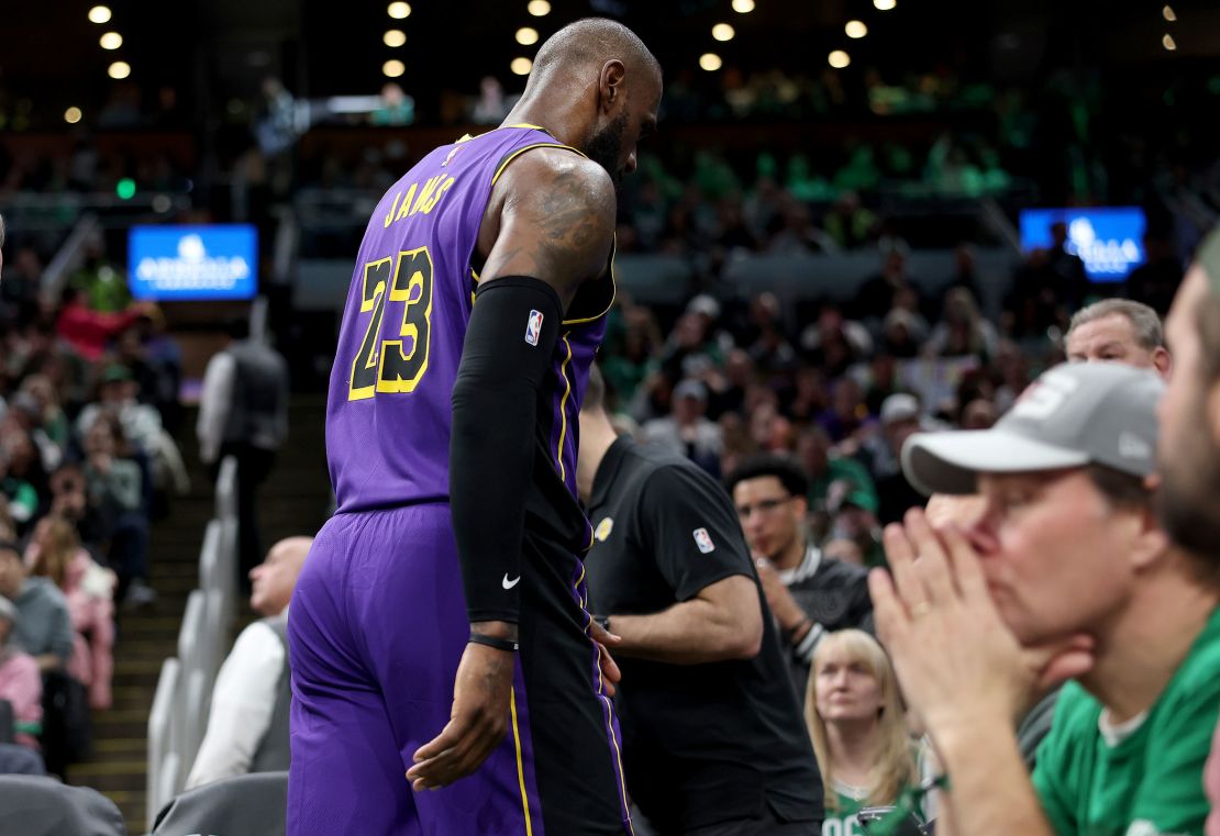 LeBron James of the Los Angeles Lakers leaves the game after an injury during the second half against the Boston Celtics at TD Garden.