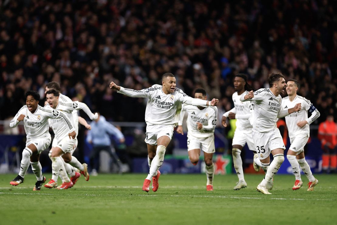 Real Madrid's players celebrate after winning the penalty shootout.