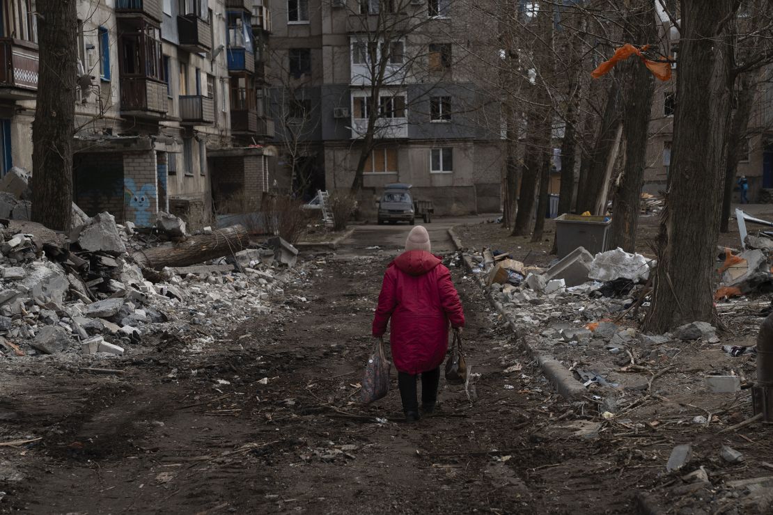 A person walks through the remains of a residential building in Kostiantynivka, Donetsk Oblast, Ukraine, that was destroyed by a bombing attack, on Thursday