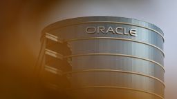 The Oracle logo is displayed on a building at an Oracle campus on March 10, 2025 in Redwood Shores, California.