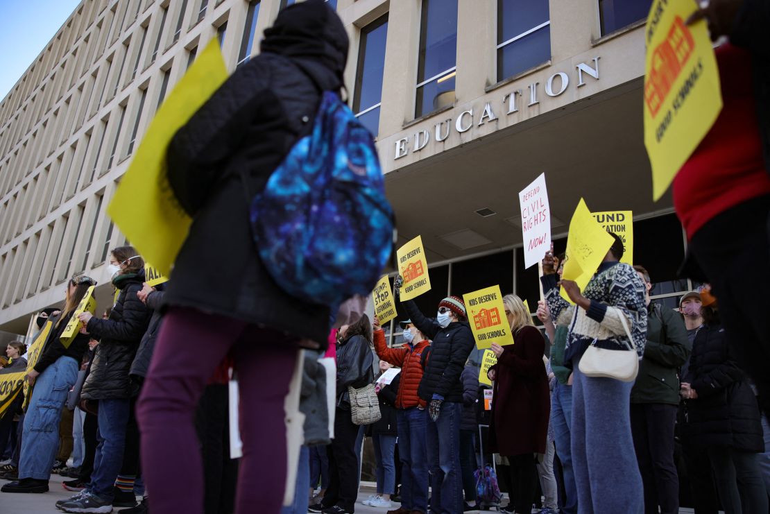 Demonstrators gather outside of the offices of the US Department of Education in Washington, DC, on March 13, 2025, to protest mass layoffs and budget cuts at the agency.