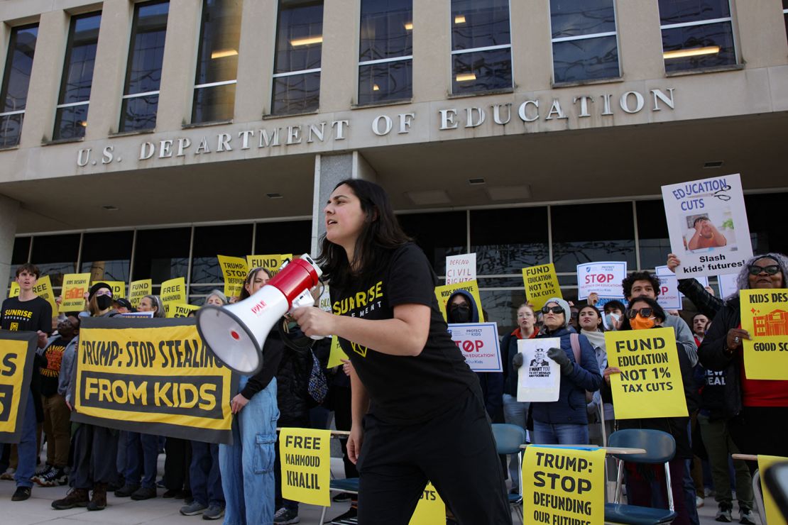 Demonstrators gather outside the offices of the Department of Education in Washington, DC, on March 13, 2025, to protest against mass layoffs and budget cuts at the agency.