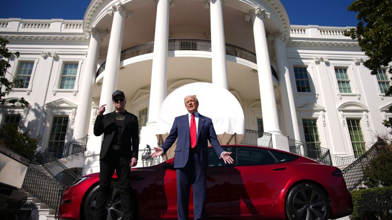 WASHINGTON, DC - MARCH 11: U.S. President Donald Trump and White House Senior Advisor, Tesla and SpaceX CEO Elon Musk deliver remarks next to a Tesla Model S on the South Lawn of the White House on March 11, 2025 in Washington, DC. Trump spoke out against calls for a boycott of Elon Musk’s companies and said he would purchase a Tesla vehicle in what he calls a ‘show of confidence and ’ for Elon Musk. (Photo by Andrew Harnik/Getty Images)