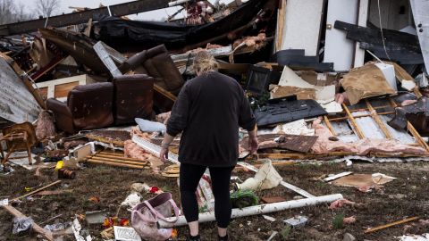 POPLAR BLUFF, MISSOURI - MARCH 15: Denise Woodard looks over her destroyed trailer inside of Harmony Hills trailer park on March 15, 2025 in Poplar Bluff, Missouri. Many homes throughout Harmony Hills were damaged by the severe weather on Friday night that left one person dead in Butler County, Missouri. At least 19 people have reportedly been killed after tornadoes and severe storms hit several midwest and southern states overnight. (Photo by Brad Vest/Getty Images)