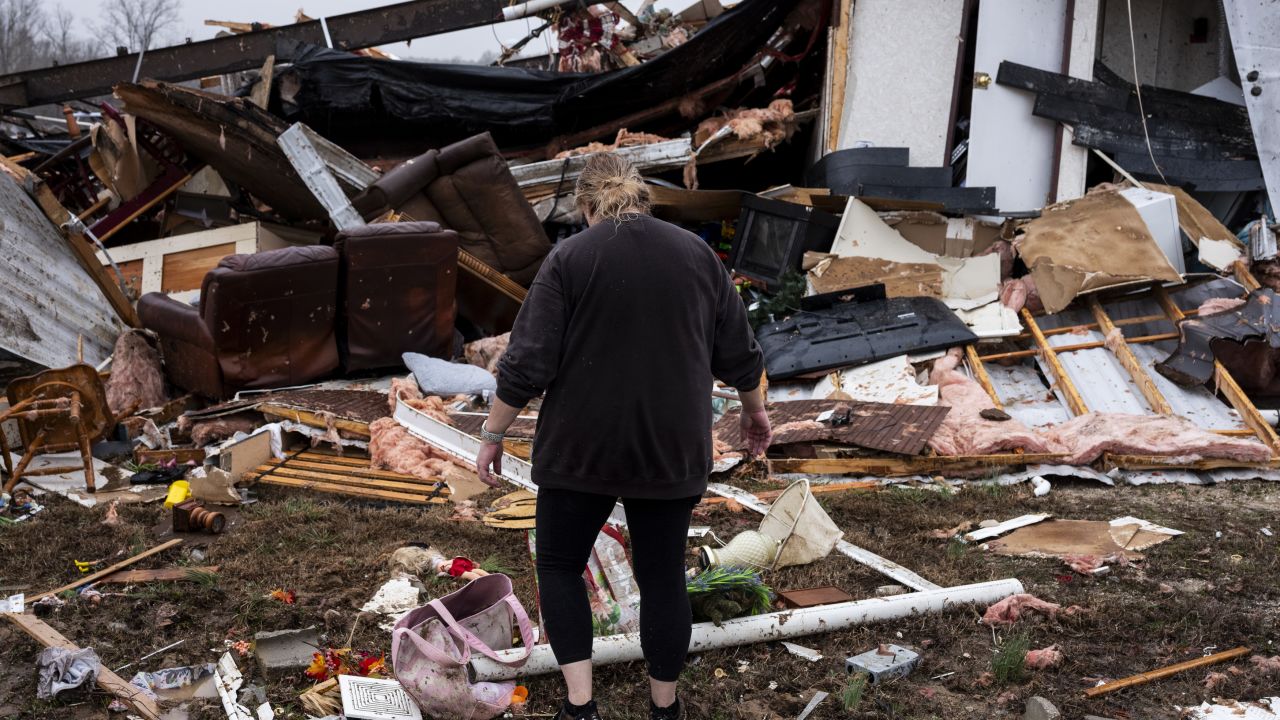 POPLAR BLUFF, MISSOURI - MARCH 15: Denise Woodard looks over her destroyed trailer inside of Harmony Hills trailer park on March 15, 2025 in Poplar Bluff, Missouri. Many homes throughout Harmony Hills were damaged by the severe weather on Friday night that left one person dead in Butler County, Missouri. At least 19 people have reportedly been killed after tornadoes and severe storms hit several midwest and southern states overnight. (Photo by Brad Vest/Getty Images)