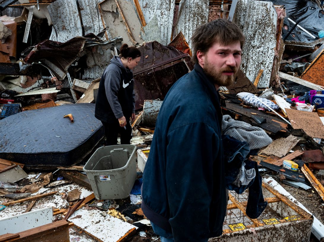 From left, Stevie Kara and Hunter Chandler search for personal items in the rubble of their destroyed home in Poplar Bluff, Missouri, on March 15, after tornadoes and severe storms passed through the area.