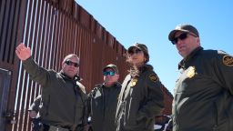 US Secretary of Homeland Security Kristi Noem (2R) listens during a tour along the Nogales border wall at the Mariposa Port of Entry in Nogales, Arizona, March 15, 2025. (Photo by Alex Brandon / POOL / AFP) (Photo by ALEX BRANDON/POOL/AFP via Getty Images)          