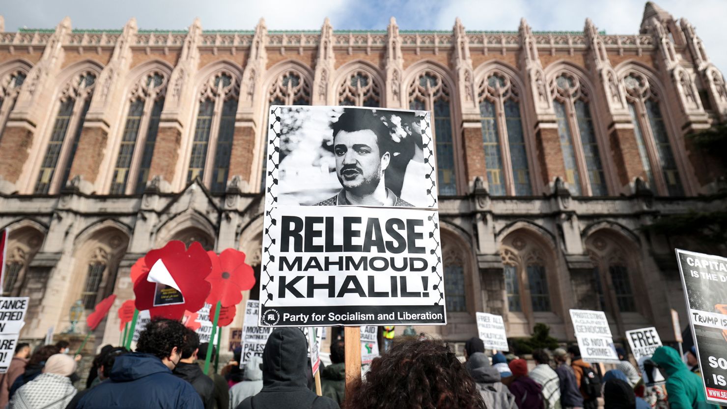 People hold signs as they protest the arrest of former Columbia University student activist Mahmoud Khalil and show support for Palestinians during a demonstration at the University of Washington campus in Seattle on March 15.