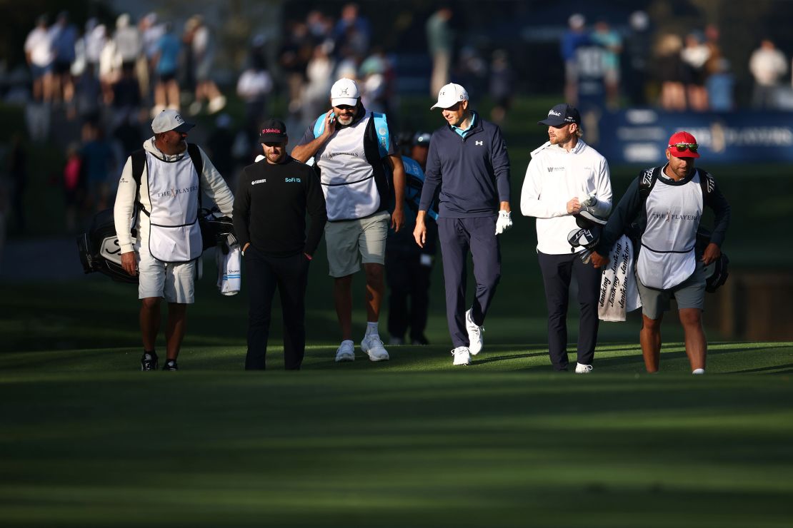 American trio Clark (left), Spieth (center) and Walker (right) walk the tenth fairway during the first round.