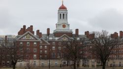 CAMBRIDGE, MASSACHUSETTS - MARCH 17: A person runs past Dunster House at Harvard University on March 17, 2025 in Cambridge, Massachusetts. Harvard University announced free tuition for students from families that make under $200K a year. (Photo by Scott Eisen/Getty Images)