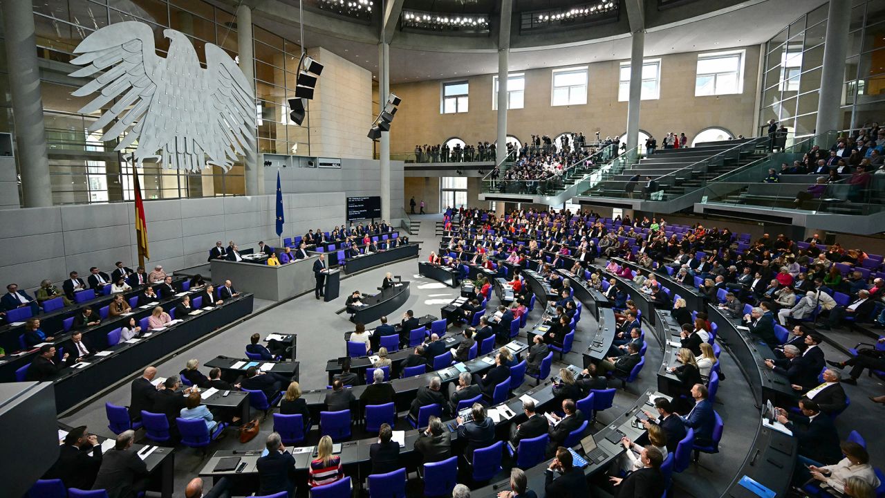 Friedrich Merz (C-L), leader of Germany's Christian Democratic Union (CDU), speaks during a session of the Bundestag (lower house of parliament) on March 18, 2025 in Berlin, Germany. German lawmakers will vote on a massive spending boost for defence and infrastructure proposed by chancellor-in-waiting Friedrich Merz amid concern over the United States' commitment to Europe's security. The hastily drawn plans represent a radical departure for a country traditionally reluctant to take on large amounts of debt or to spend heavily on the military, given the horrors of its Nazi past. (Photo by Tobias SCHWARZ / AFP) (Photo by TOBIAS SCHWARZ/AFP via Getty Images)          