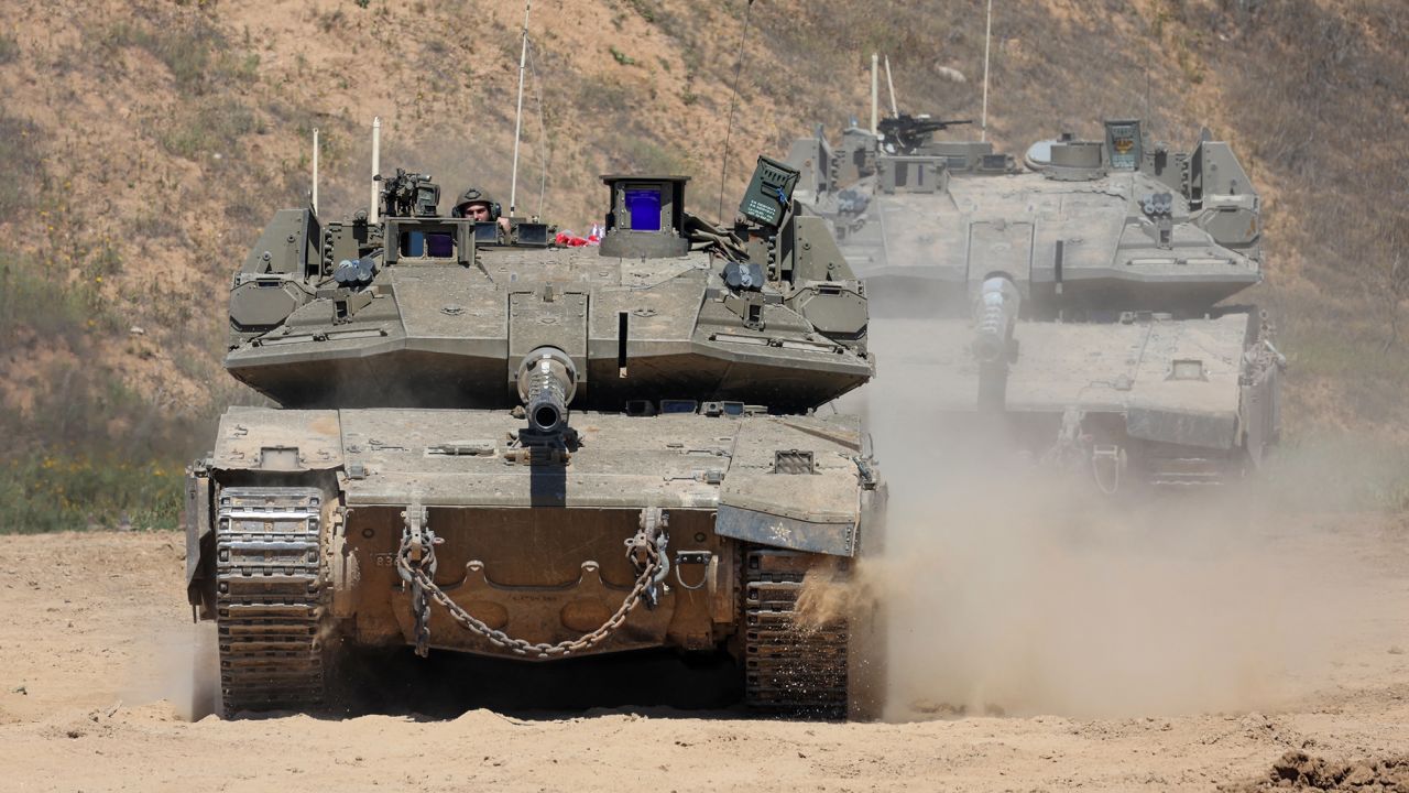 An Israeli soldiers operates a tank near the southern border with Gaza on Wednesday.