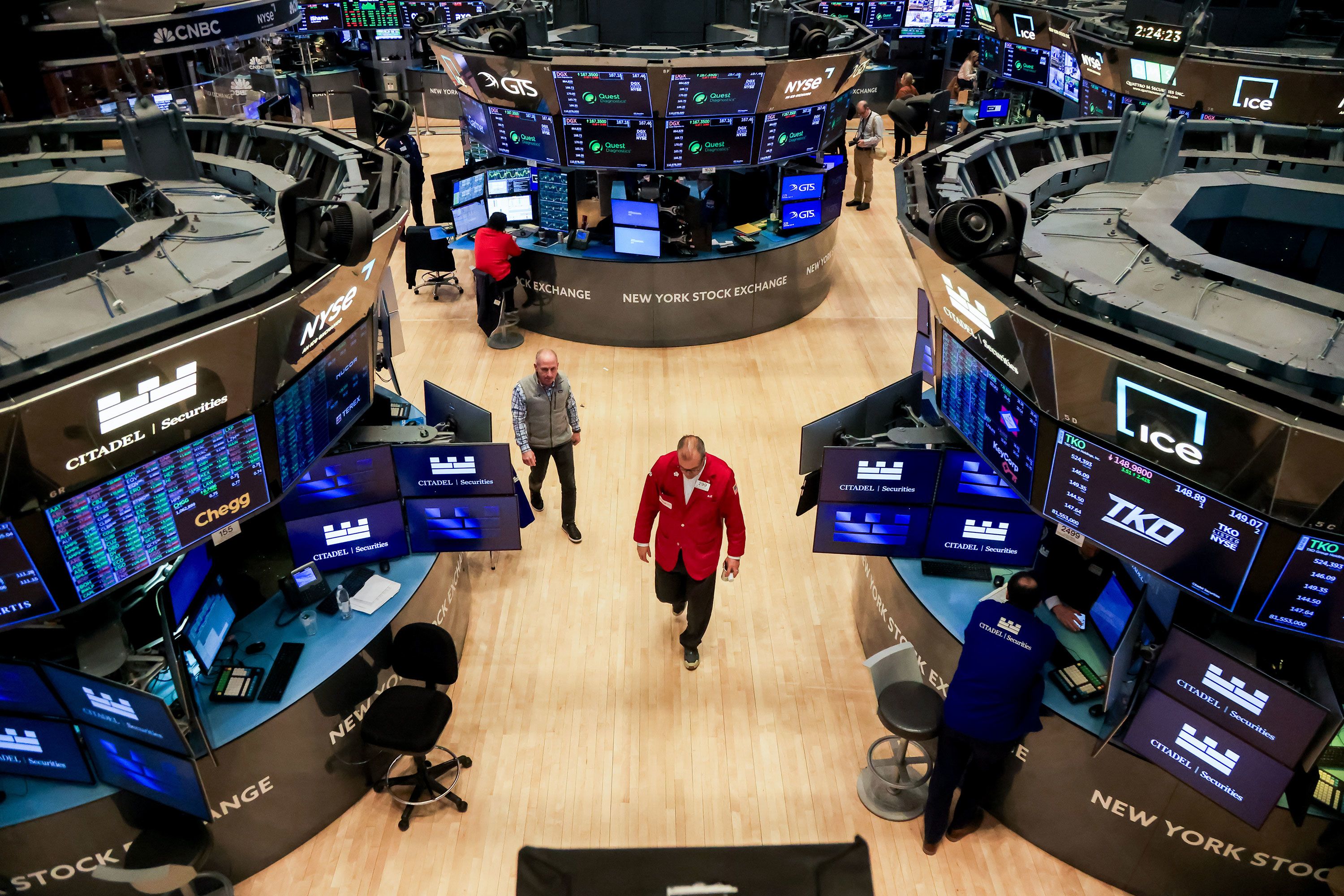 Traders work on the floor of the New York Stock Exchange today.