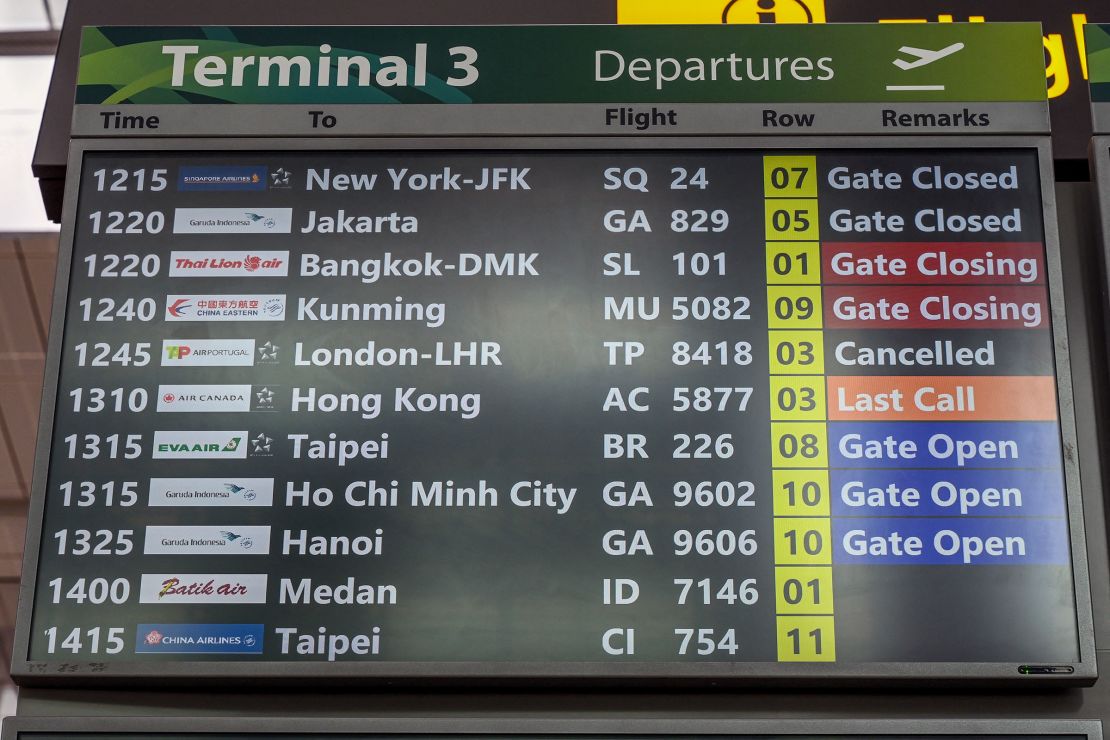 A departure board displays Air Portugal flight TP8418 to Heathrow as canceled at Singapore Changi Airport on Friday.