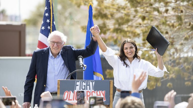 Sen. Bernie Sanders, left, joins Rep. Alexandria Ocasio-Cortez on stage before speaking at Fighting Oligarchy: Where We Go From Here rally on March 20, in North Las Vegas.