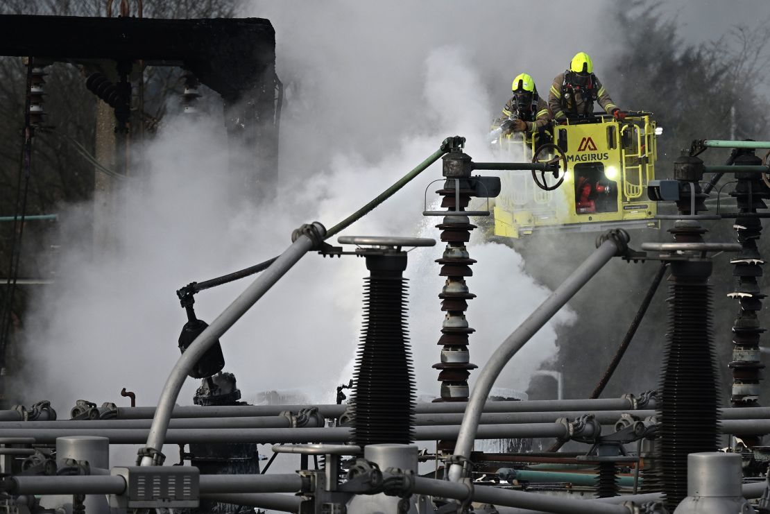 Firefighters at the scene following a major fire at the North Hyde electricity substation, which has caused a significant power outage at Heathrow Airport.