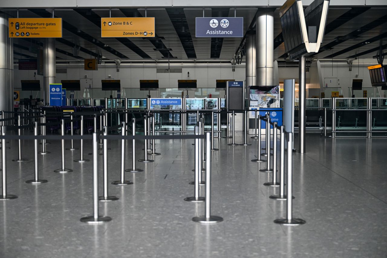 Empty check-in desks are seen at Terminal 4 at London Heathrow Airport on Friday.