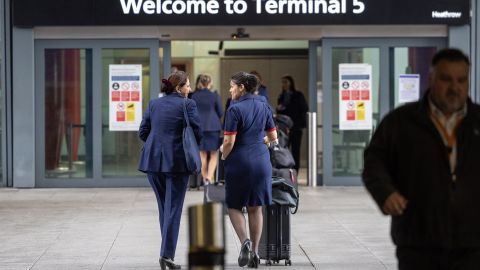 LONDON, ENGLAND - MARCH 21: British Airways crew  arrive at terminal 5 at Heathrow on March 21, 2025 in London, England. Flights resumed after a fire at a nearby electricity sub-station took out the power and grounded aircraft. (Photo by Peter Nicholls/Getty Images)