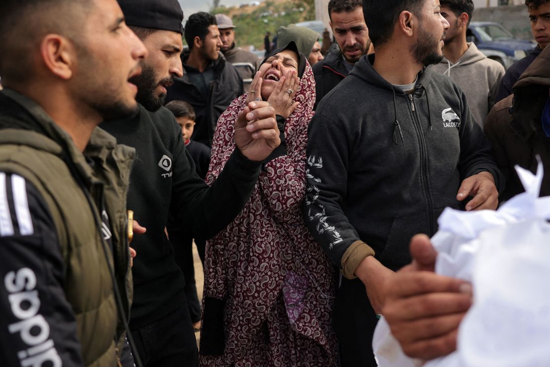 A woman mourns near the bodies of relatives killed in an Israeli strike, in the yard of the Indonesian hospital in Beit Lahia in the northern Gaza Strip on Sunday.