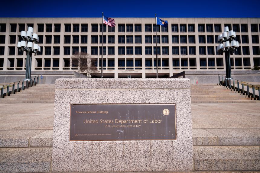 The US Department of Labor building is seen behind a sign marking the location of the agency's headquarters on March 18 in Washington, DC.
