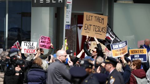 Protestors demonstrate during a "Tesla Takedown" protest against CEO Elon Musk in New York on March 22, 2025. US President Donald Trump's senior advisor Elon Musk is leading the so-called Department of Government Efficiency (DOGE), which has cut thousands of government jobs and upended agencies, prompting numerous court challenges. (Photo by CHARLY TRIBALLEAU / AFP) (Photo by CHARLY TRIBALLEAU/AFP via Getty Images)          