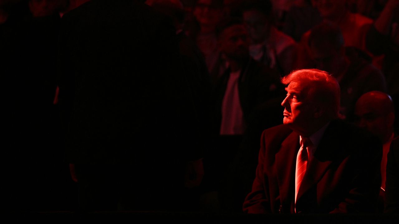 TOPSHOT - US President Donald Trump attends the men's NCAA wrestling competition at the Wells Fargo Center in Philadelphia, Pennsylvania, on March 22, 2025. (Photo by Brendan SMIALOWSKI / AFP) (Photo by BRENDAN SMIALOWSKI/AFP via Getty Images)          