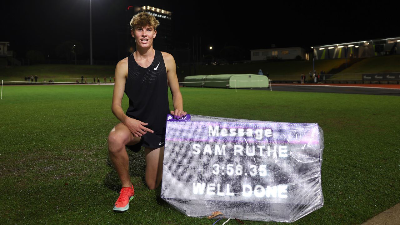 AUCKLAND, NEW ZEALAND - MARCH 19: New Zealand middle distance runner Sam Ruthe poses with his time of 3:58.35 in the mile distance at Mt Smart Stadium on March 19, 2025 in Auckland, New Zealand. Ruthe broke the four minute mile barrier, placing him as the youngest person in history and first under 15 years old to break the record. (Photo by Phil Walter/Getty Images)