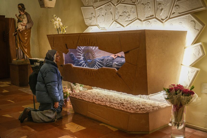 A nun prays at the tomb of Blessed Carlo Acutis in the Church of Santa Maria Maggiore in Assisi, Italy, on March 18.