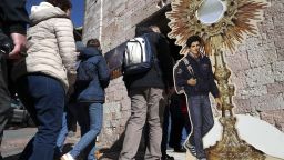 Pilgrims queue to enter the Church of Santa Maria Maggiore and Sanctuary of the Renunciation and to pay their respects at the tomb of the Blessed Carlo Acutis in on March 18, 2025 in Assisi, Italy.