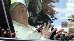 Pope Francis waves as he leaves by car the Gemelli hospital after a five weeks hospitalization for pneumonia, in Rome on March 23, 2025. Pope Francis is to leave hospital todayand return to his residence in the Vatican, where he is to spend "at least two months" recovering, one of his doctors announced during a press conference on March 22, 2025. (Photo by Tiziana FABI / AFP) (Photo by TIZIANA FABI/AFP via Getty Images)          