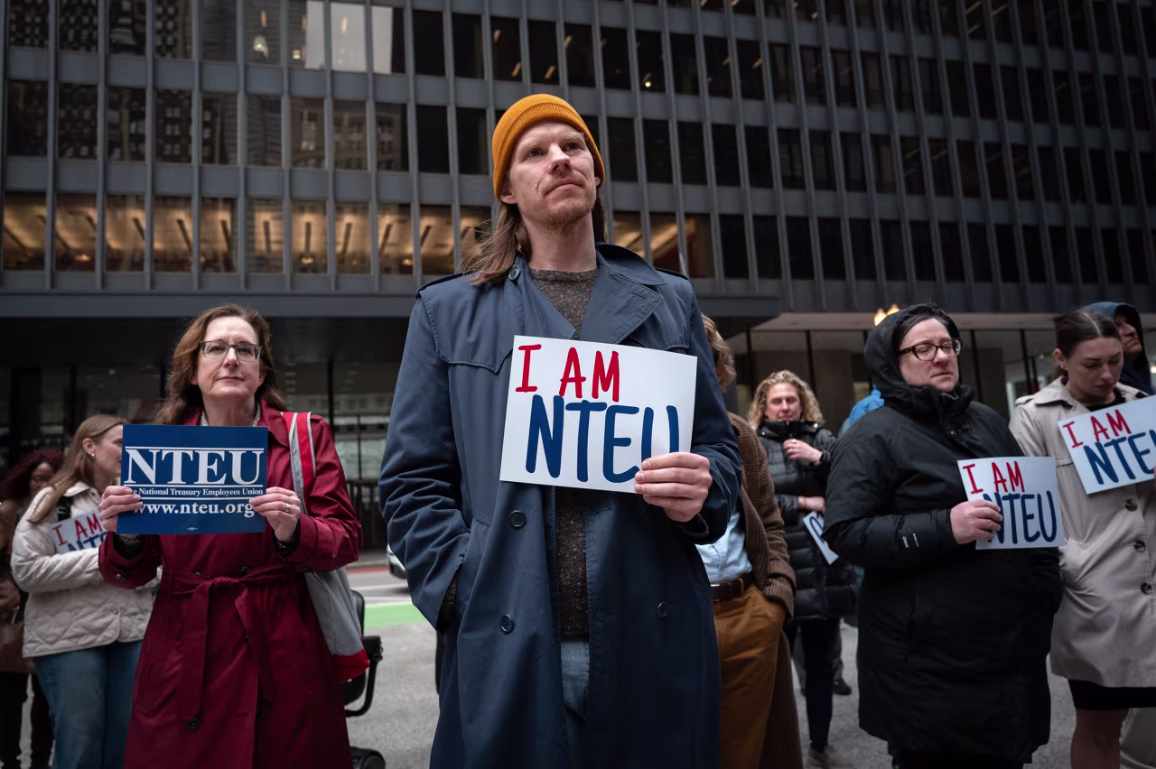 Federal employees rally, organized by the National Treasury Employees Union  to voice concerns about the mass firing of federal workers, outside of the Kluczynski Federal Building in Chicago on March 19.