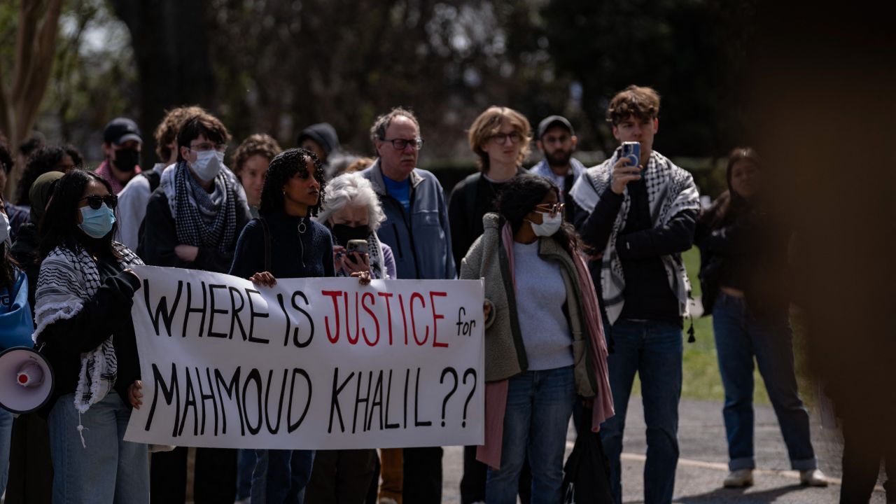 A protester holds a sign reading "WHERE IS JUSTICE for MAHMOUD KHALIL??" during a demonstration against ICE, MPD, and other law enforcement agencies on college campuses in Washington, D.C., on March 23, 2025. The protest, organized by Georgetown University students and community leaders, also called for the release of a Georgetown scholar facing deportation by the Department of Homeland Security. (Photo by Andrew Thomas / Middle Eeast Images / Middle East Images via AFP) (Photo by ANDREW THOMAS/Middle Eeast Images/AFP via Getty Images)