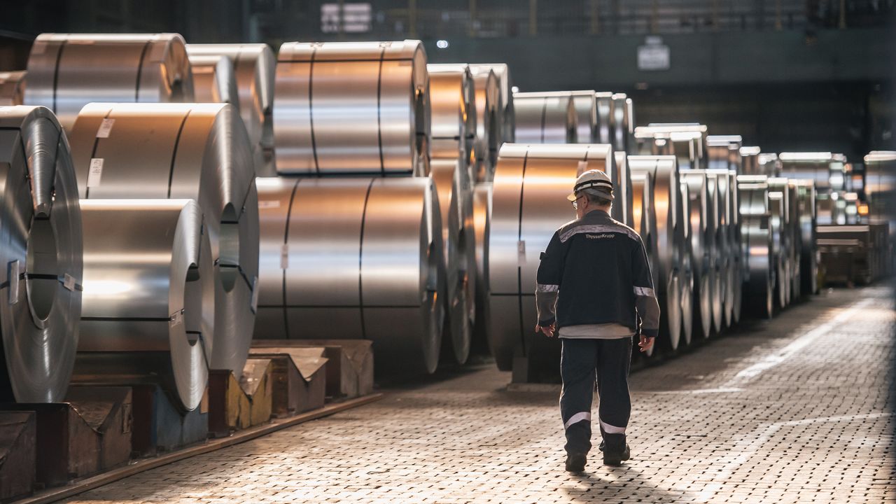 A worker walks past coils of finished steel at the Thyssenkrupp steel mill on March 20, 2025 in Duisburg, Germany. The European Commission is enacting its European Steel Action Plan in an effort to restore competitiveness to the European steel sector, which has been hobbled by high energy costs and faces stiff competition from abroad, particularly in Asia. The recent introduction of tariffs by the administration of U.S. President Donald Trump on steel and aluminum imports is a further setback.