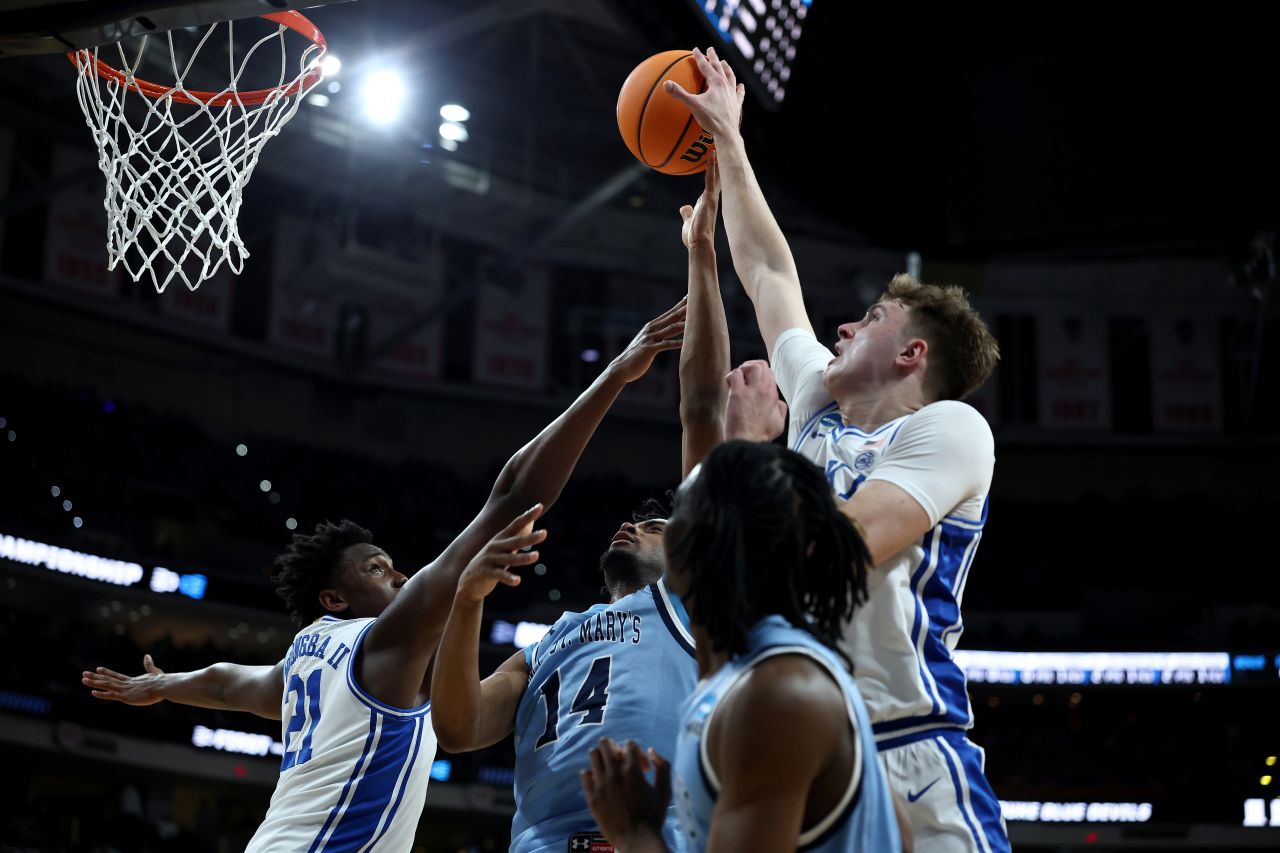 Duke forward Cooper Flagg battles for possession against the Mount St. Mary's Mountaineers.