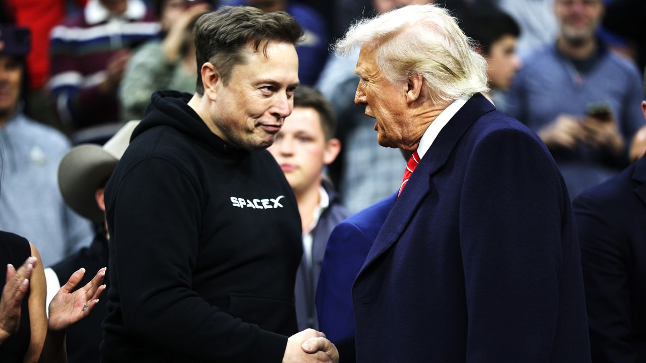President Donald Trump and White House Senior Advisor, Tesla and SpaceX CEO Elon Musk shake hands while attending the NCAA Division I Wrestling Championship on March 22, 2025 in Philadelphia, Pennsylvania.