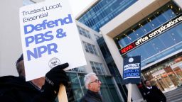 People rally to call on Congress to protect funding for Public Broadcasting Service (PBS) and National Public Radio outside the NPR headquarters in Washington, DC, on March 26, 2025.