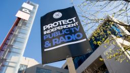 People participate in a rally to call on Congress to protect funding for US public broadcasters, Public Broadcasting Service (PBS) and National Public Radio (NPR), outside the NPR headquarters in Washington, DC, on March 26, 2025.