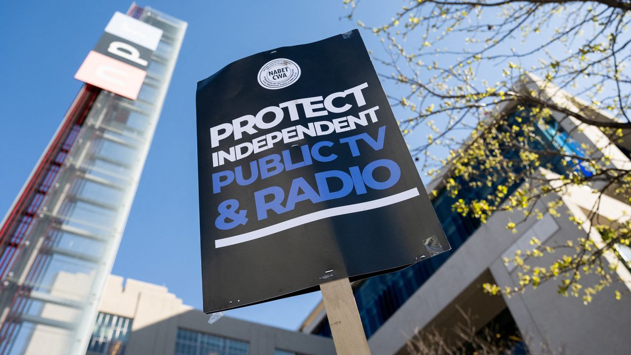 People participate in a rally to call on Congress to protect funding for US public broadcasters, Public Broadcasting Service (PBS) and National Public Radio (NPR), outside the NPR headquarters in Washington, DC, on March 26, 2025.