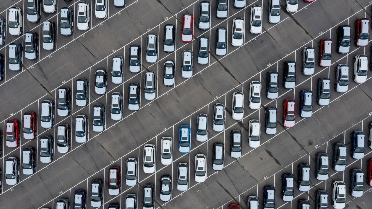 a view of a parking lot filled with lots of parked cars