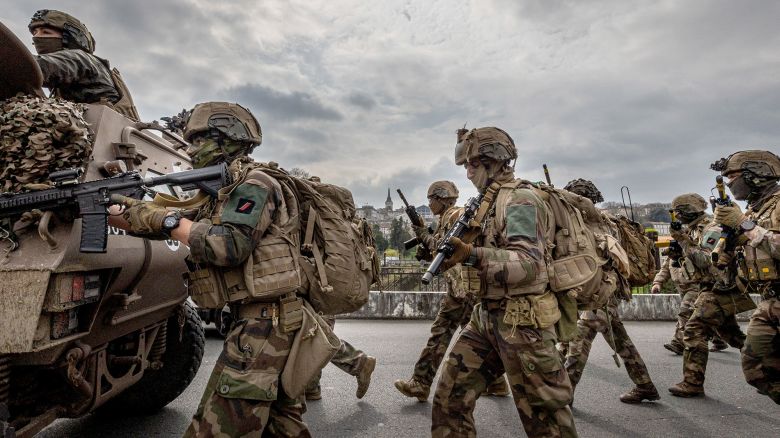 Under the overflight of a Gendarmerie helicopter, the assault column of the First Marine Infantry Regiment advances during the Balerit joint and combined military exercise at Angouleme in the Charente department in the Nouvelle Aquitaine region of western France, on March 26, 2025. (Photo by Romuald Goudeau / Hans Lucas / Hans Lucas via AFP) (Photo by ROMUALD GOUDEAU/Hans Lucas/AFP via Getty Images)          