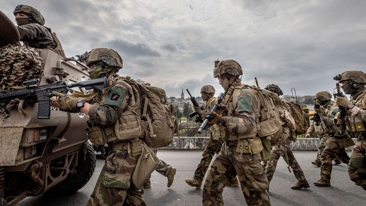 Under the overflight of a Gendarmerie helicopter, the assault column of the First Marine Infantry Regiment advances during the Balerit joint and combined military exercise at Angouleme in the Charente department in the Nouvelle Aquitaine region of western France, on March 26, 2025. (Photo by Romuald Goudeau / Hans Lucas / Hans Lucas via AFP) (Photo by ROMUALD GOUDEAU/Hans Lucas/AFP via Getty Images)          