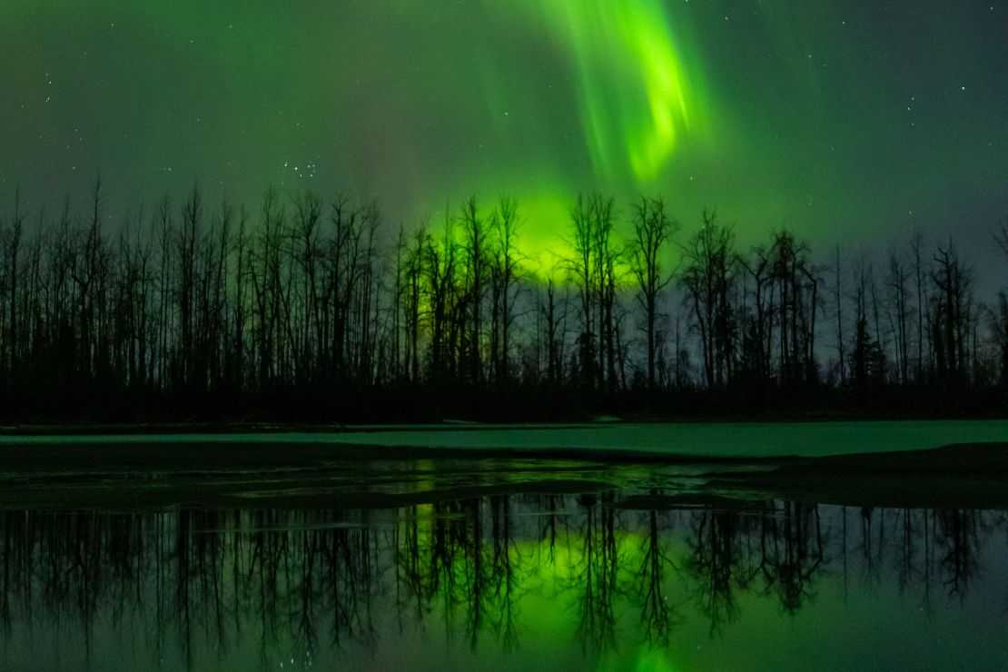 Travel experts say they're seeing Americans pull back on big trips such as viewing the Northern Lights in Alaska.