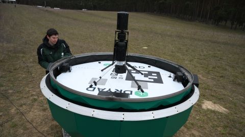 An engineer works at an AI-based drone system during a presentation of sensors technology company Dryad 'Silvaguard' the first autonomous, AI-based drone system for early forest fire detection in Eberswalde, eastern , on March 27, 2025. (Photo by RALF HIRSCHBERGER / AFP) (Photo by RALF HIRSCHBERGER/AFP via Getty Images)          