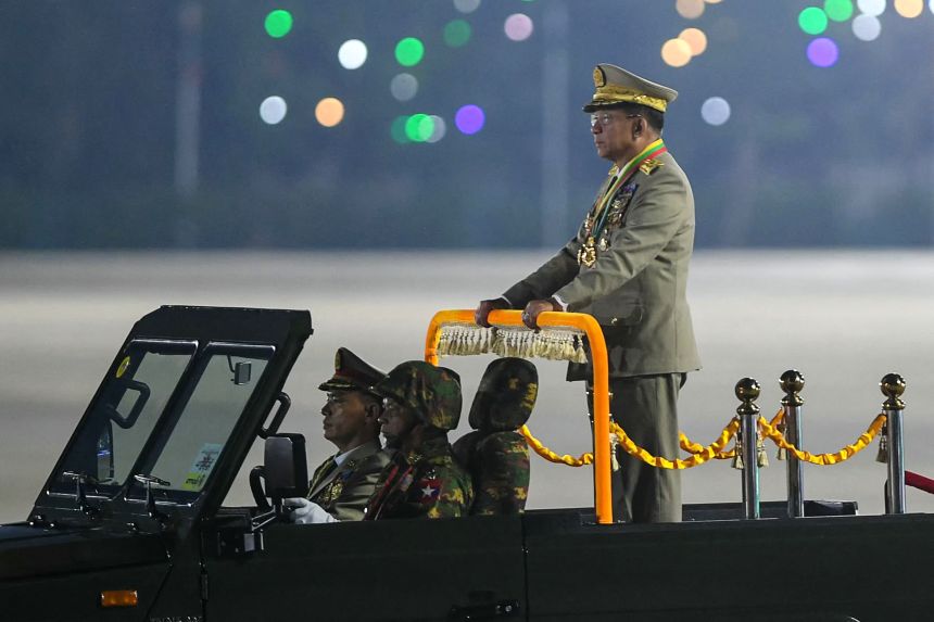 Myanmar's military chief Min Aung Hlaing arrives to deliver a speech during a ceremony to mark the country's Armed Forces Day in Naypyidaw on March 27.