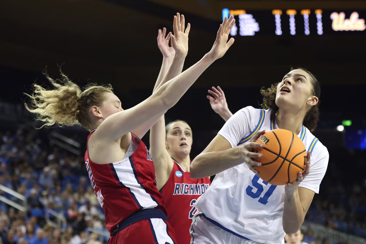 Lauren Betts #51 of the UCLA Bruins shoots as Addie Budnik #20 of the Richmond Spiders defends during the NCAA Women's Basketball Tournament in Los Angeles, California on Sunday.
