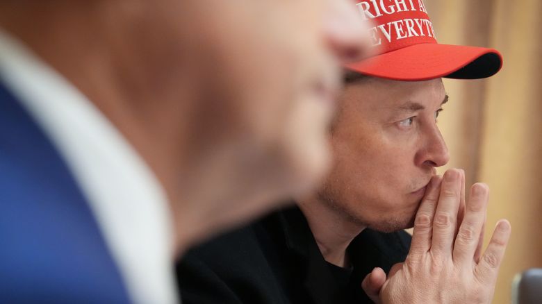 Elon Musk listens during a cabinet meeting held by President Donald Trump at the White House on March 24.
