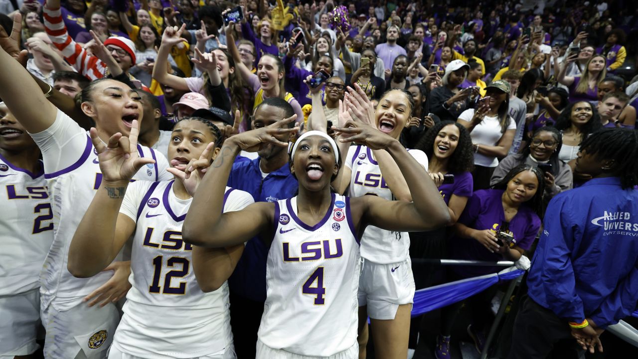 BATON ROUGE, LOUISIANA - MARCH 24: Flau'Jae Johnson #4 of the LSU Lady Tigers celebrates in the student section after a game against the Florida State Seminoles during the second round of the 2025 NCAA women's basketball tournament held at Pete Maravich Assembly Center on March 24, 2025 in Baton Rouge, Louisiana. (Photo by Tyler Kaufman/Getty Images)