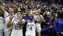 BATON ROUGE, LOUISIANA - MARCH 24: Flau'Jae Johnson #4 of the LSU Lady Tigers celebrates in the student section after a game against the Florida State Seminoles during the second round of the 2025 NCAA women's basketball tournament held at Pete Maravich Assembly Center on March 24, 2025 in Baton Rouge, Louisiana. (Photo by Tyler Kaufman/Getty Images)