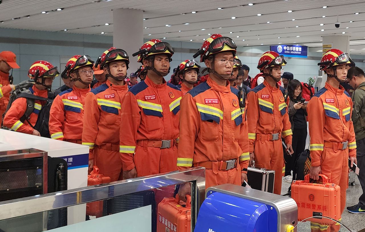A rescue and medical team gathers at the Changshui International Airport in Kunming, Yunnan province of China, before departing for Myanmar.